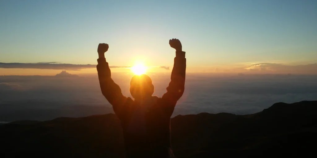 chris spurling growth mindset symbolized by celebrating progress and success at sunrise